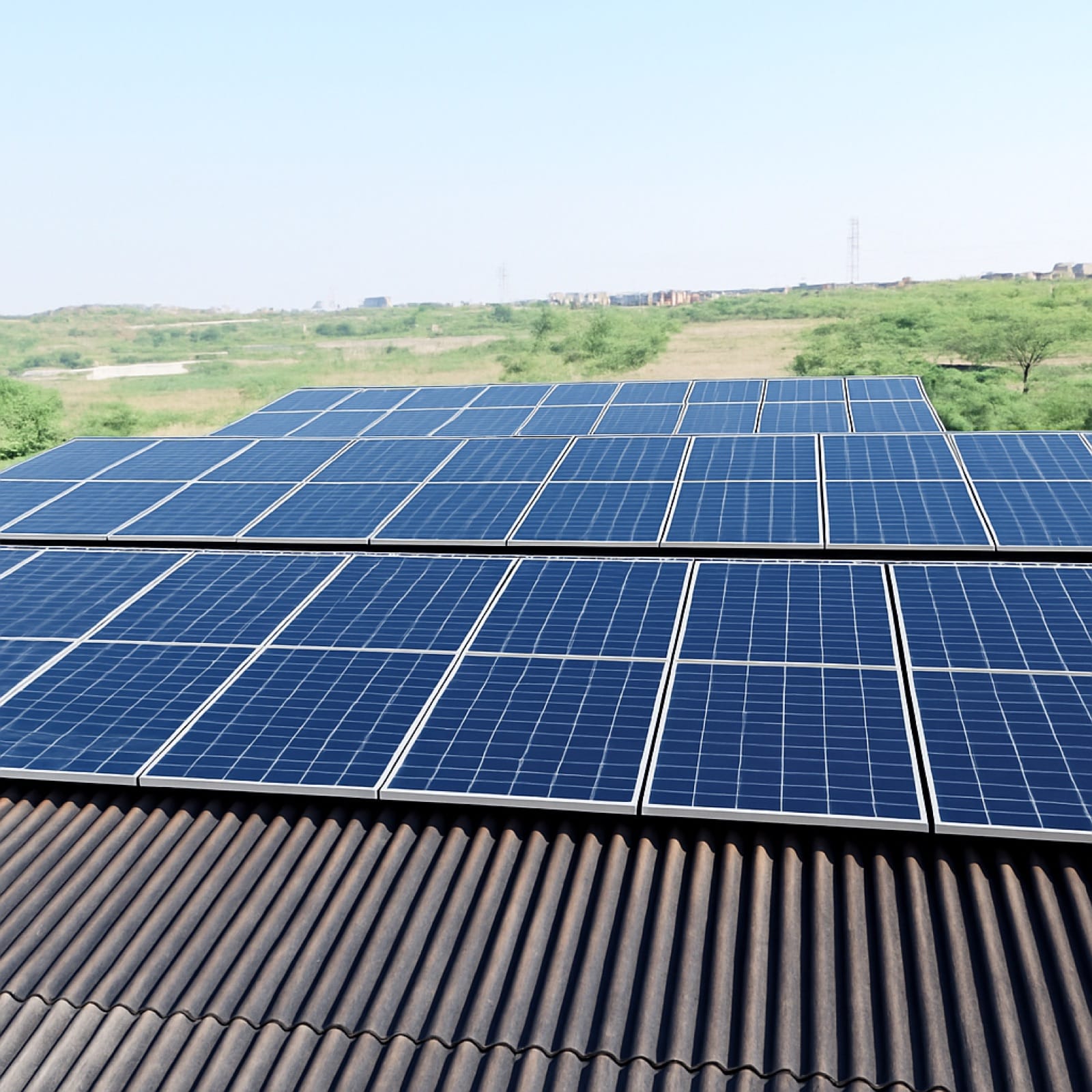 Solar panels installed on mill land alongside open fields