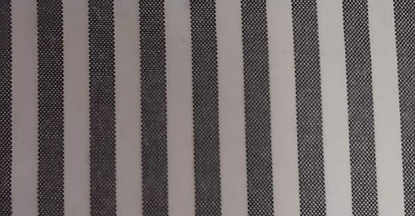 Close-up of black and white big-line hospital bed sheet fabric